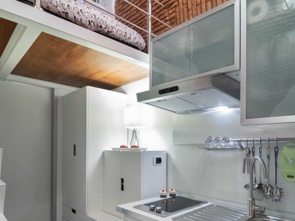the-little-house-has-a-full-kitchen-a-bathroom-with-a-shower-a-small-lofted-sofa-bed-and-an-led-tv-with-hi-fi-sound-system
