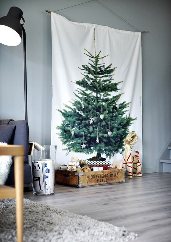 A pine tree printed fabric hanging is festive without the mess! #Alternativetree #Christmasdecor @weddingchicks: