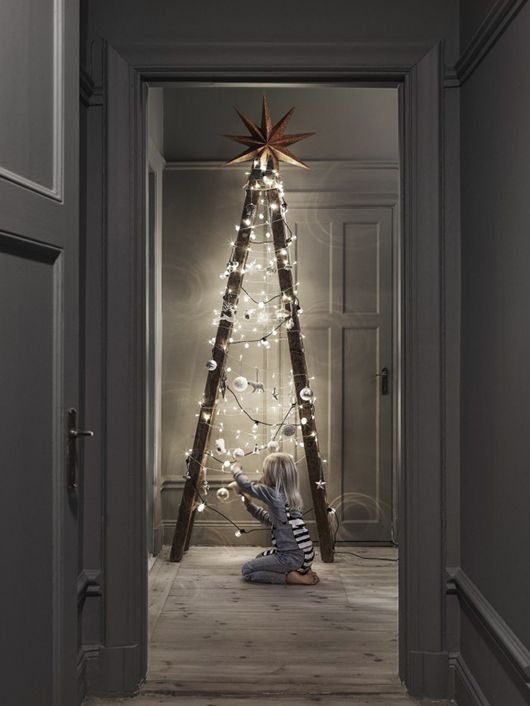 ladder styled as christmas tree decor with string lights + ornaments [more colorful: https://pinterest.com/pin/282178732872080087/ ]: 